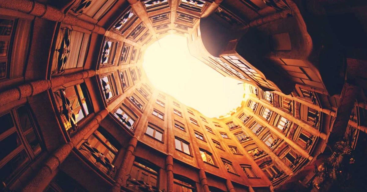 A collection of documents including a passport and visa application forms on a desk