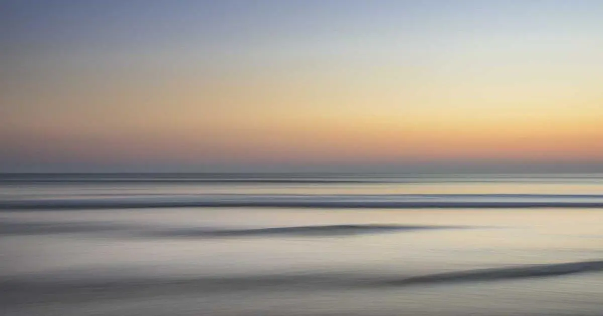 Tourist visa documents, passport photo, and application papers on a desk